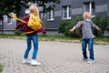 Back to school. children playing on street. Kids wearing mask and backpacks protect and safety coronavirus. Boy and girl Royalty Free Stock Photo