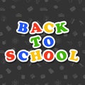 Back to school colorful text on dark background with icons. Royalty Free Stock Photo