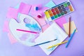 Back to school, colorful watercolor paints and gouache, brushes and colored pencils, palette Royalty Free Stock Photo