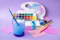 Back to school, colorful watercolor paints and gouache, brushes and colored pencils, palette Royalty Free Stock Photo