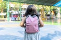 Back to school concept. An Asian girl, she is walking to her school. Royalty Free Stock Photo