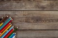 Back to school concept background with colored pencils on wooden table, flat lay Royalty Free Stock Photo