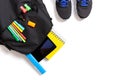 Back to school concept. Backpack with school supplies, tablet and sport sneakers Royalty Free Stock Photo