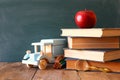 Back to school concept. Blackboard with books Royalty Free Stock Photo