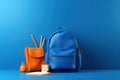 Back to school concept on blue background. Modern school bag, books, accessories and colorful pencils with abacus 3D Render 3D Royalty Free Stock Photo