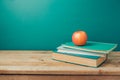Back to school concept with books and apple on wooden table Royalty Free Stock Photo