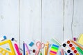 Back to school concept, border frame of colorful stationery supplies for teaching kids drawing on empty white wooden desk. Royalty Free Stock Photo