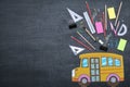 Back to school concept. School bus made of paper, Put on a black