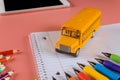 Back to school concept with bus and notebook pencil Royalty Free Stock Photo