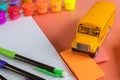 Back to school concept with bus and notebook pencil Royalty Free Stock Photo