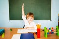 Back to school concept. Cheerful Schoolboy ready to answer question Royalty Free Stock Photo