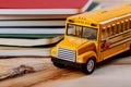 Back to school concept, colored pen, copybook, toy yellow school bus wood background Royalty Free Stock Photo