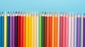 Back to school concept, colorful pencils in a row isolated blue background with copy space, teacher\'s day promotion banner Royalty Free Stock Photo