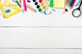 Back to school concept, colorful stationery supplies for teaching kids drawing on empty white wooden desk. Creative education