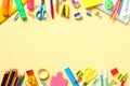 Back to school concept. Double border frame made of colorful school supplies on yellow background. Flat lay, top view, copy space Royalty Free Stock Photo