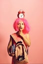 Back to school concept: girl with red alarm on head Royalty Free Stock Photo