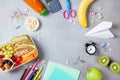 Back to school concept. Healthy lunch box and colorful stationery on table top view. Royalty Free Stock Photo