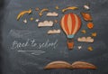 Back to school concept. Hot air balloon, space elements shapes cut from paper and painted over classroom blackboard background. Royalty Free Stock Photo