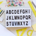 Back to school concept. Letters from A to Z. English alphabet on a lightbox on a white wooden surface, top view. From above, flat Royalty Free Stock Photo