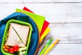 Back to school concept. Lunch box, stationery and backpack. Royalty Free Stock Photo