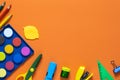 Back to school concept. School and office supplies on the office table. Orange background.Flat lay.Autumn Royalty Free Stock Photo