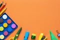 Back to school concept. School and office supplies on the office table. Orange background.Flat lay Royalty Free Stock Photo