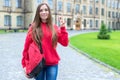 Back to school concept. Photo portrait of one in bright jeans casual clothes youngster millennial lady giving v-sign standing near