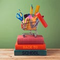 Back to school concept with shopping cart on books Royalty Free Stock Photo