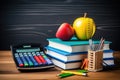 Back to school concept. Stack of books, apple, pencils and calculator on wooden table. Back to School background concept. School Royalty Free Stock Photo