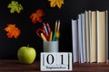 Back to school concept. School stationery and calendar dated September 1st. Selective focus