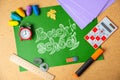Back to school concept. School supplies on green board