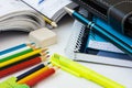 Back to school concept, supplies, multicolored pencils, notepads, highlighter, pen, textbook, rubber, white desktop, learning