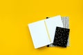 Back to school concept. School supplies: open notebook and pen on yellow background. Top view. Copy space. Flat lay. Mock-up Royalty Free Stock Photo