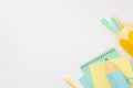 Back to school concept. Top view photo of school accessories blue pencil-case copybooks and yellow stand for pens on isolated Royalty Free Stock Photo