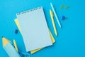 Back to school concept. Top view photo of school accessories copybooks pens binder clips and pencil-case on isolated blue Royalty Free Stock Photo