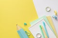 Back to school concept. Top view photo of colorful stationery blue pencil-case stack of diaries pens binder clips and adhesive