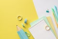 Back to school concept. Top view photo of colorful school supplies blue pencil-case stack of planners pens binder clips and Royalty Free Stock Photo