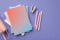 Back to school concept. Top view photo of stack of colorful notebooks pens stapler ruler clips and pink pencil-case on isolated Royalty Free Stock Photo