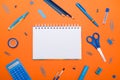 Back to School concept. Top view school supplies on a student desk on orange background. Flat lay and copy space Royalty Free Stock Photo