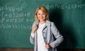 Back to school concept. Woman smiling educator classroom chalkboard background. Working conditions which prospective Royalty Free Stock Photo