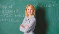 Back to school concept. Working conditions which prospective teachers must consider. Woman smiling educator classroom Royalty Free Stock Photo