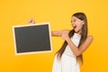 Back to school. copy space. summer vacation and holiday. happy childhood. little girl pointing finger blackboard Royalty Free Stock Photo