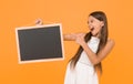 back to school. copy space. summer vacation and holiday. happy childhood. little girl pointing finger blackboard Royalty Free Stock Photo