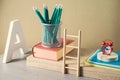 Back to school creative concept with pencils, books and alarm clock. Modern still life composition Royalty Free Stock Photo