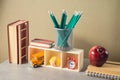 Back to school creative concept with pencils, books, apple and alarm clock. Modern still life composition Royalty Free Stock Photo