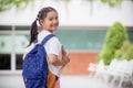 Back to school. Cute Asian child girl with a backpack running and going to school with fun Royalty Free Stock Photo