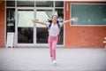 Back to school. Cute Asian child girl with a backpack running and going to school with fun Royalty Free Stock Photo