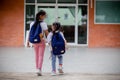 Back to school. Cute Asian child girl with a backpack running and going to school with fun Royalty Free Stock Photo