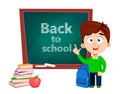 Back to school. Cute boy standing near blackboard Royalty Free Stock Photo