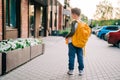 Back to school. Cute child with backpack going to school. Boy pupil with bag. Elementary school student going to classes Royalty Free Stock Photo